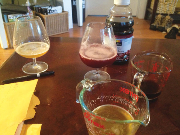 measuring cups, beer, and juice on a wooden table top
