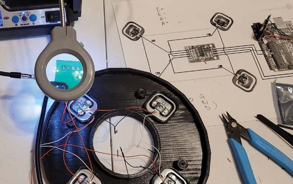 a look at the scale's four load cells being wired together